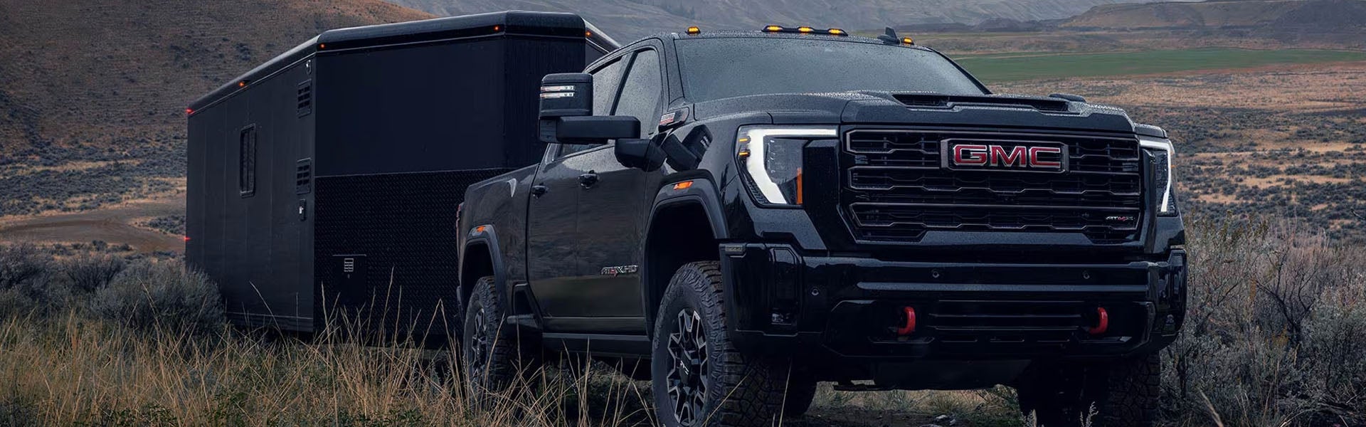 GMC Sierra 2500 HD towing trailer off-road